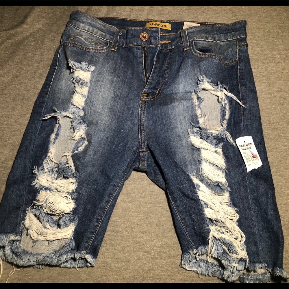 Above the knee ripped shorts